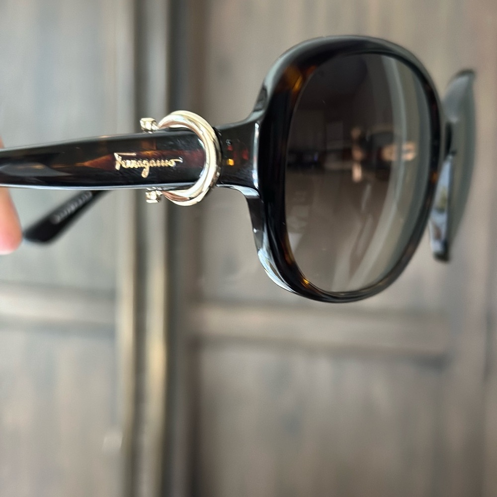 Salvatore Ferragamo dark brown with a hint of dark blond Sunglasses.